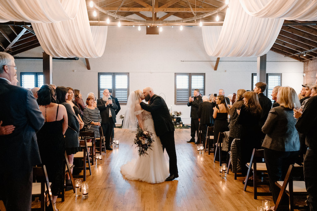 Wedding ceremony in interior of a Gainesville industrial venue