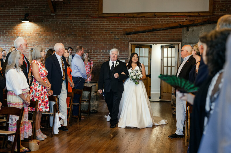 Bride walking down aisle at industrial wedding ceremony in Gainesville