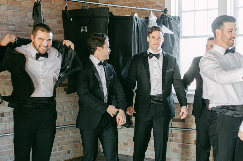 Groomsen dressing for wedding ceremony in The Chair Factory venue