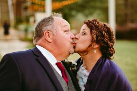 The Chair Factory owners kissing after North Georgia wedding